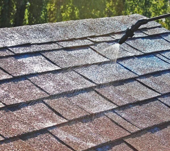 Asphalt shingle roof being sealed