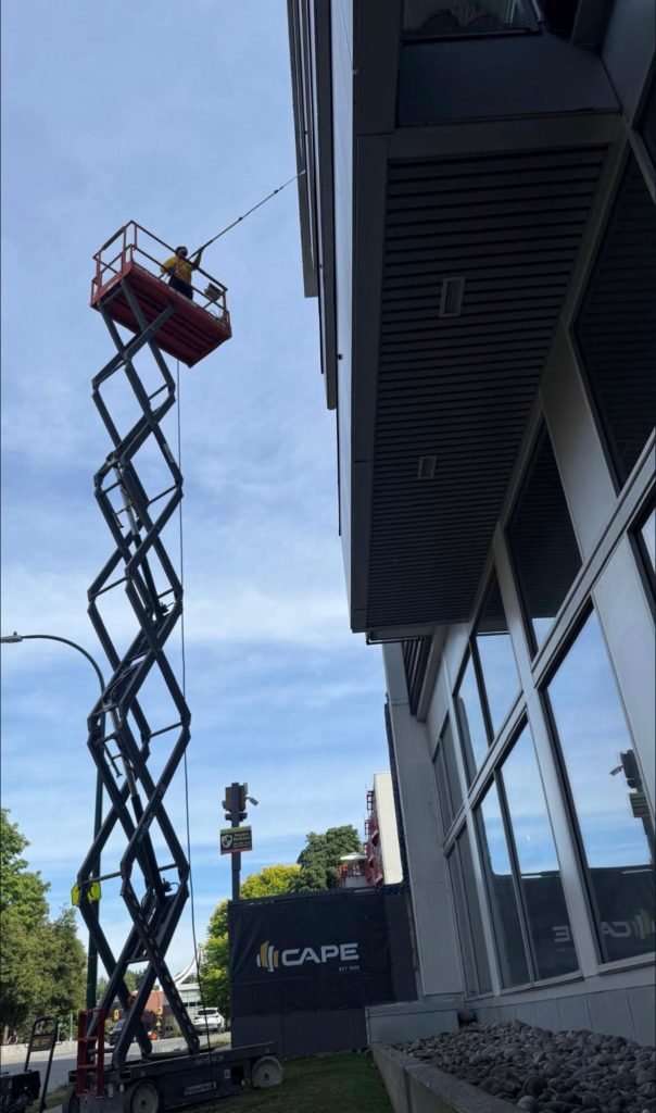 Worker on a hydraulic scissor lift