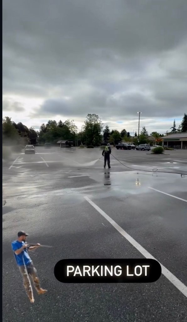 Person in a wet parking lot
